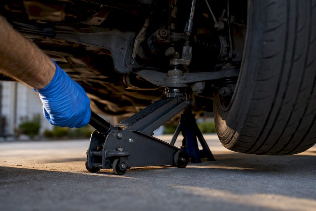 Mechanic checking suspension ball joint